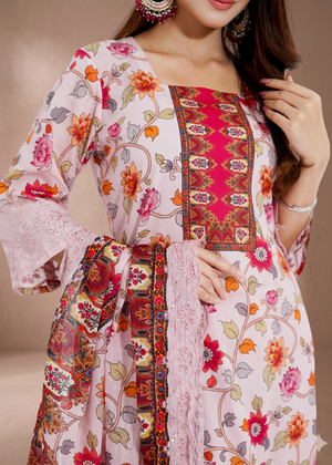 Woman wearing a floral and patterned outfit with a neutral background
